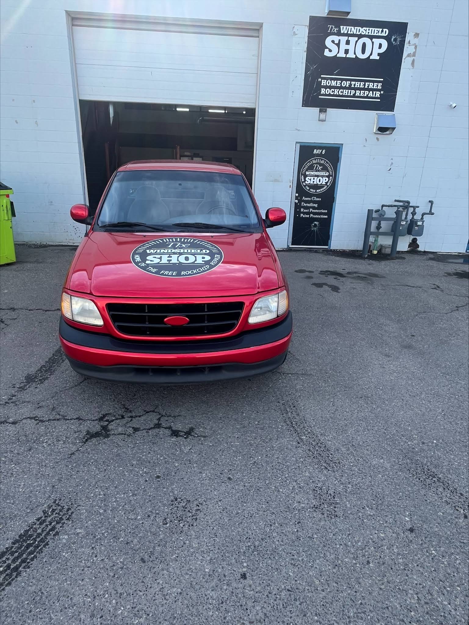 The Windshield Shop branded red truck outside the Calgary shop